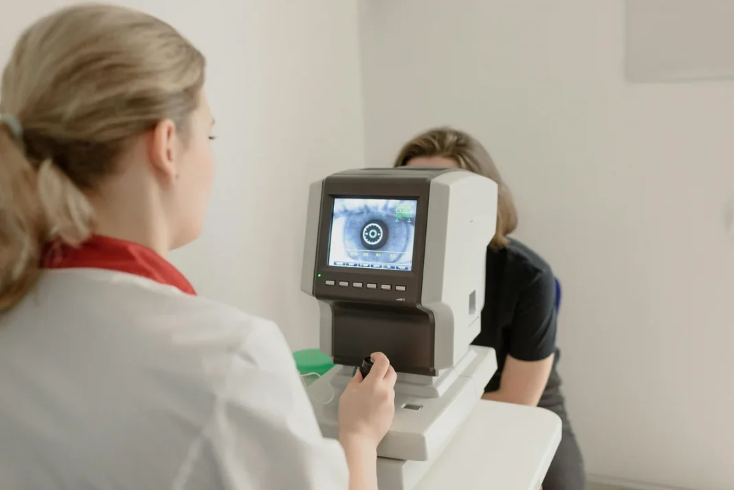 Optometrist performing an eye exam with professional equipment in an Australian eye care clinic Eye care